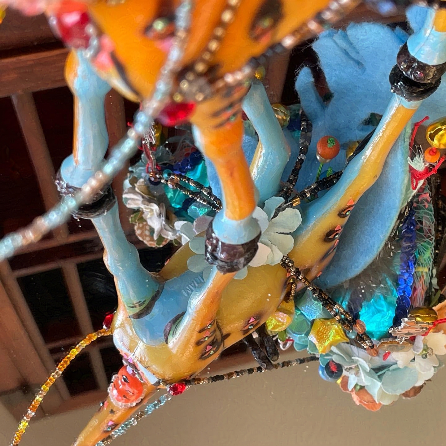 Reflective floor showing that the underside of the orange is giraffe painted blue.