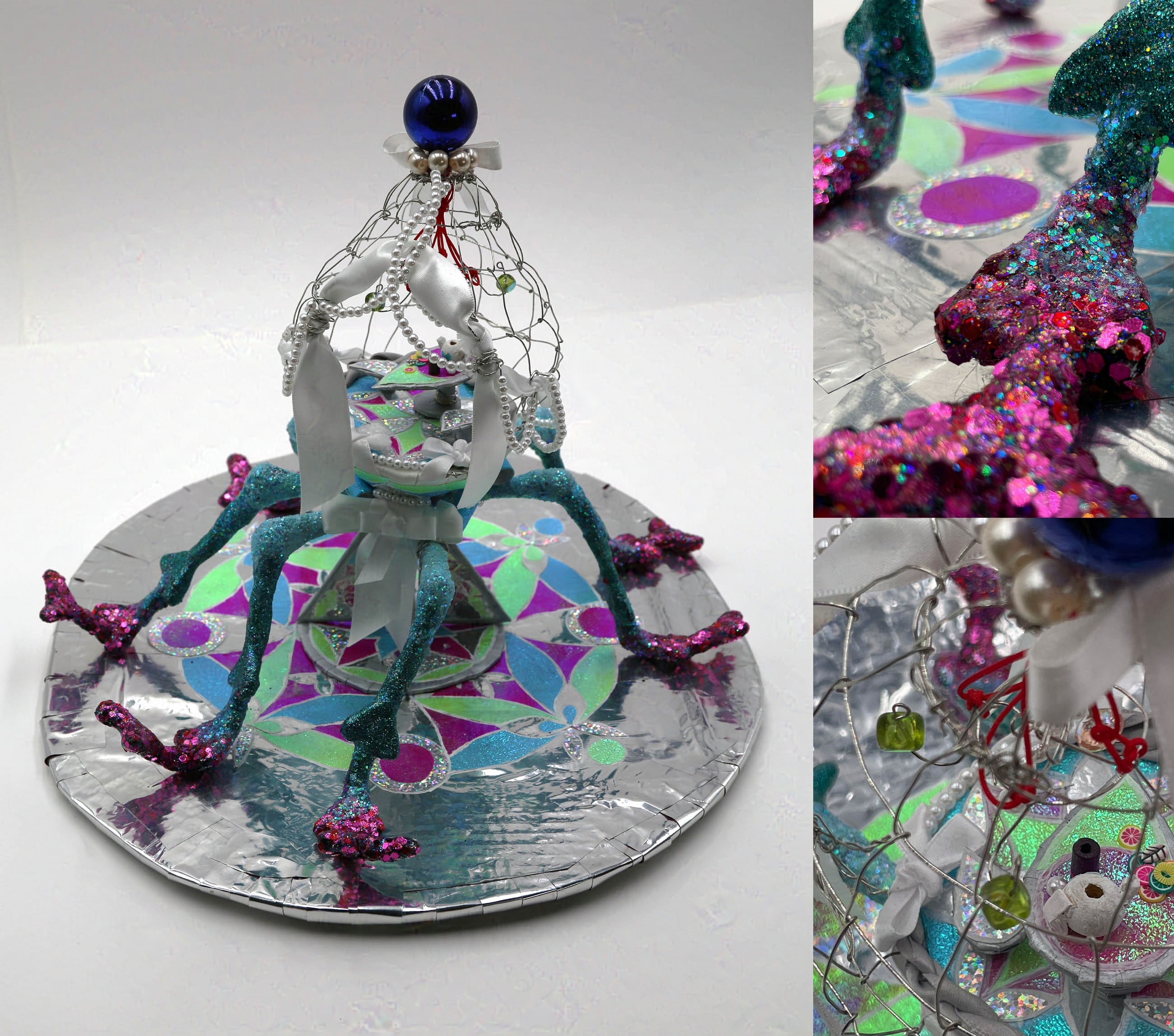 Reference image for drawing on the left. Tea table is inside the body of a sculpture of a bug-like building with blue and purple glittery weevil legs.